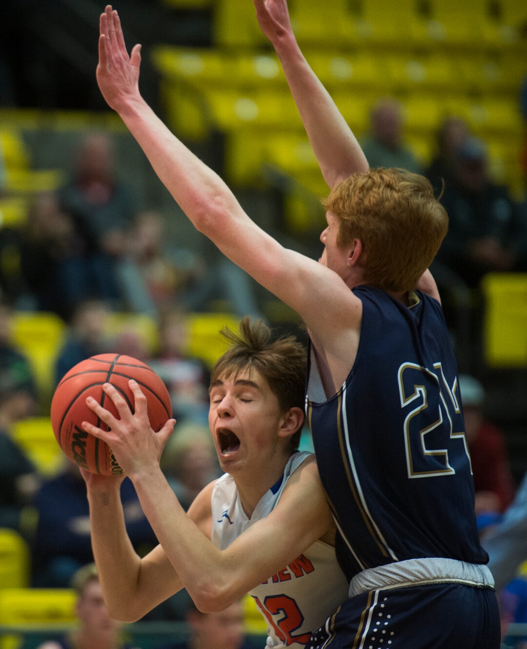 (Rick Egan  |  The Salt Lake Tribune)  Timpview Thunderbirds Kelson Jensen (12) goes up againt Skyline Eagles Andrew Clark (24), in 5A basketball playoff action between the Timpview Thunderbirds and at the Skyline Eagles, at the UCCU Center in Orem, Monday, Feb. 26, 2018.