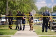 (Chris Samuels | The Salt Lake Tribune) Police investigate a shooting that occurred outside a meetinghouse of The Church of Jesus Christ of Latter-day Saints in Kearns, Monday, Aug. 17, 2026. A father and son were charged with murder on Thursday in connection with the shooting.