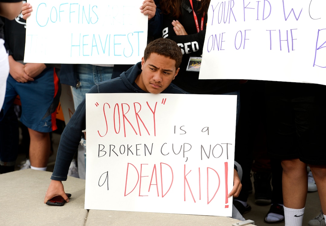 (Leah Hogsten  |  The Salt Lake Tribune) East High School student Sione Fineu left school to raise awareness and push for change with his classmates. Exactly one month after 17 people were killed at Marjory Stoneman Douglas High School in Parkland, survivors of the massacre joined tens of thousands of students across the United States by walking out of school,  Wednesday, March 14, 2018. 
