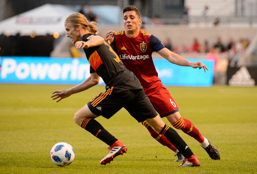 (Trent Nelson | The Salt Lake Tribune)  Houston's Jared Watts (33) and Real Salt Lake midfielder Damir Kreilach (6) as Real Salt Lake hosts Houston Dynamo, MLS Soccer at Rio Tinto Stadium in Sandy, Utah, Wednesday May 30, 2018.