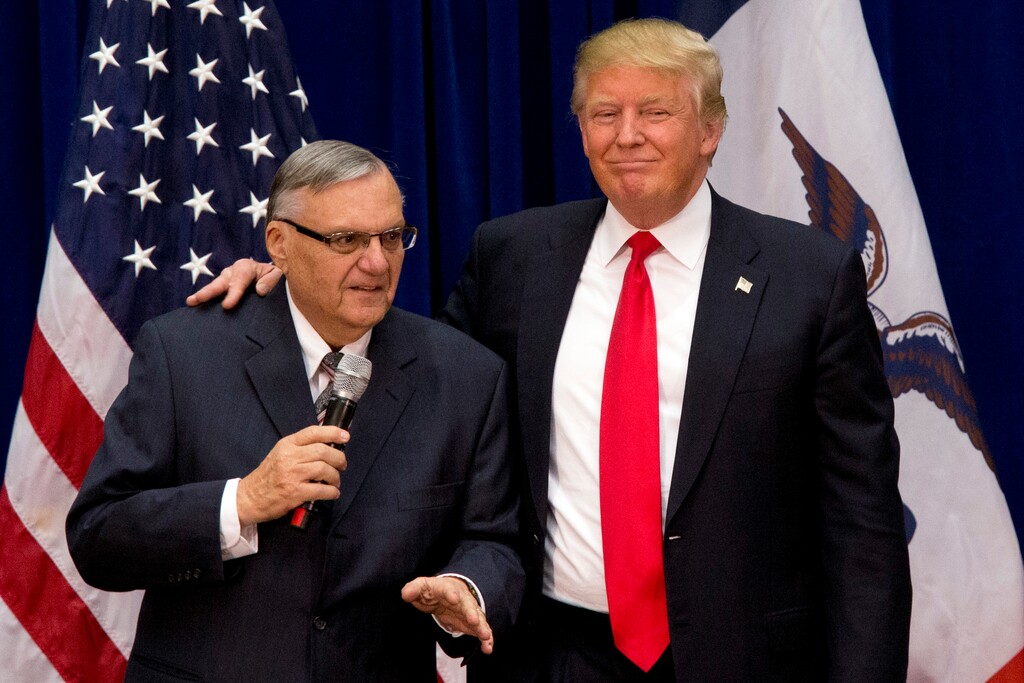 (Mary Altaffer | The Associated Press) In this Jan. 26, 2016 file photo, then-Republican presidential candidate Donald Trump is joined by Joe Arpaio, the sheriff of metro Phoenix, at a campaign event in Marshalltown, Iowa.