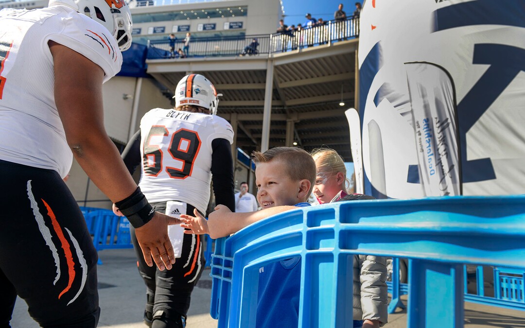 (Leah Hogsten  |  The Salt Lake Tribune) Kyler Jones and his sister Paizlee greet Bengals players as Brigham Young University takes on Idaho State, Saturday, Nov. 16, 2019 at LaVell Edwards Stadium.