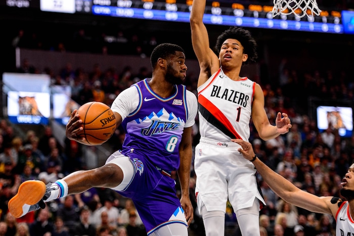(Trent Nelson  |  The Salt Lake Tribune) Utah Jazz guard Jordan Clarkson (8) passes around Portland Trail Blazers guard Anfernee Simons (1) as the Utah Jazz host the Portland Trail Blazers, NBA basketball in Salt Lake City on Thursday, Dec. 26, 2019.