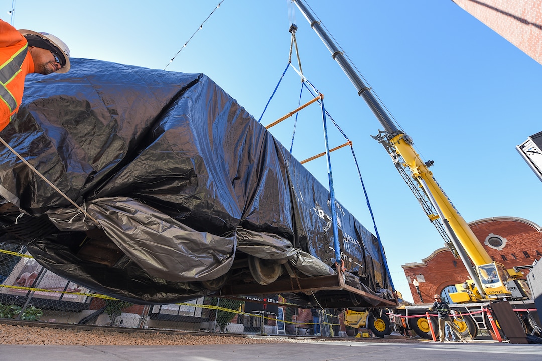 (Francisco Kjolseth  |  The Salt Lake Tribune)  The iconic trolley car, that has been sitting in storage for several years, is moved back into view at Trolley Square on Monday, Oct. 15, 2018. The empty trolley car, last seen housing the Trolley Wing Company was moved into place on the north plaza by Pottery Barn.