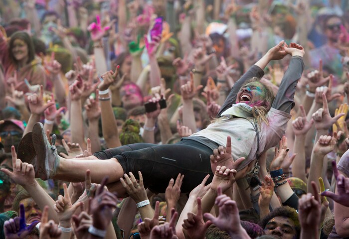 (Rick Egan  |  The Salt Lake Tribune)     Revelers crowd surf, during the 22nd annual Holi Festival of Colors at the Sri Sri Radha Krishna Temple in Spanish Fork, Saturday, March 24, 2018. The festival which celebrates the beginning or spring is also known as at the Festival of Love.