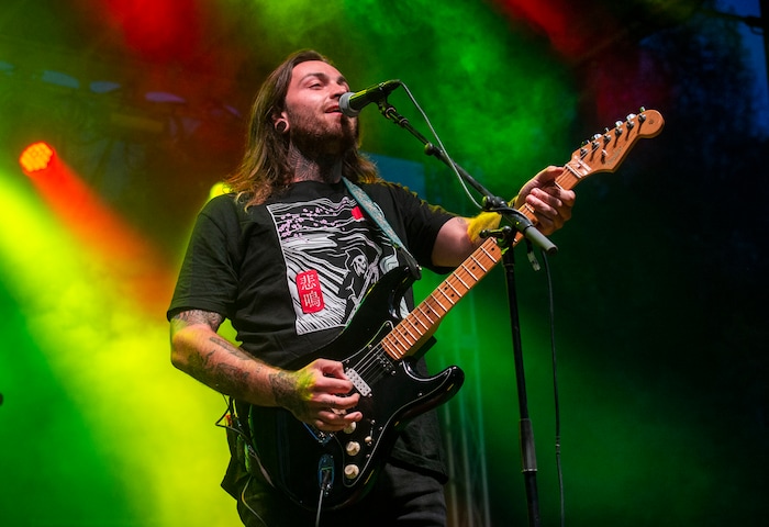 (Rick Egan  |  The Salt Lake Tribune)   Nathan Feinstein sings and plays guitar for Iya Terra, as they perform at the Reggae Rise Up music Festival, at the Rivers Edge near Heber City, Saturday, Aug. 24, 2019.