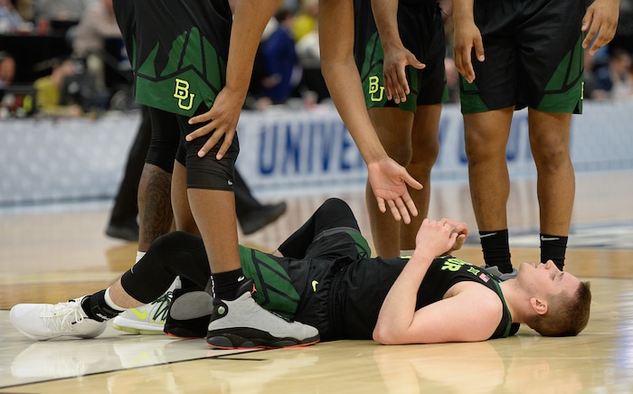 (Francisco Kjolseth  |  The Salt Lake Tribune)  Baylor Bears guard Makai Mason (10) takes a moment to get back up as Syracuse faces Baylor in their first round menÕs NCAA March Madness tournament game at Vivint Smart Home Arena in Salt Lake City on Thursday, March 21, 2019.
