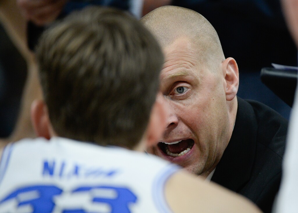 (Francisco Kjolseth  |  The Salt Lake Tribune)  Head coach for BYU Mark Pope talks with his team during a time out as BYU takes on UNLV in men's NCAA basketball at Vivint Smart Home Arena in Salt Lake City on Sat. Dec. 7, 2019.