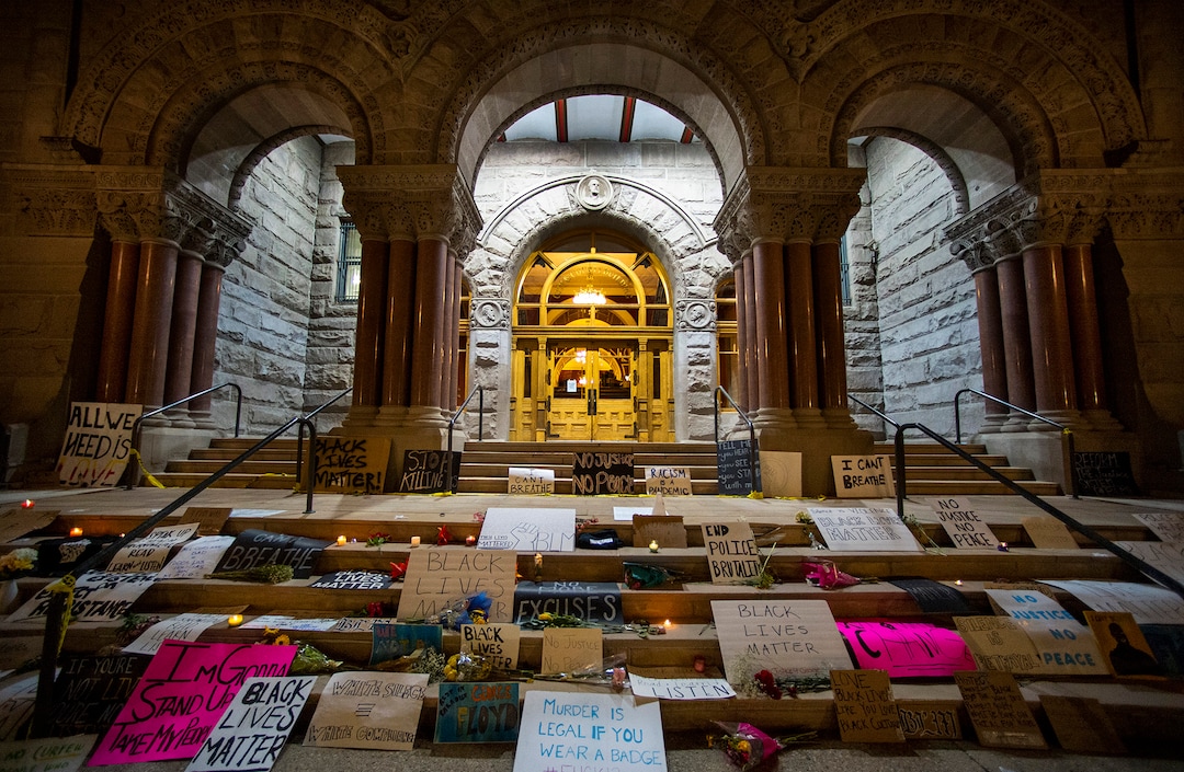 (Rick Egan  |  The Salt Lake Tribune)    Posters, flowers and candles line the steps of the Salt Lake City and County Building as a memorial, Wednesday, June 3, 2020.