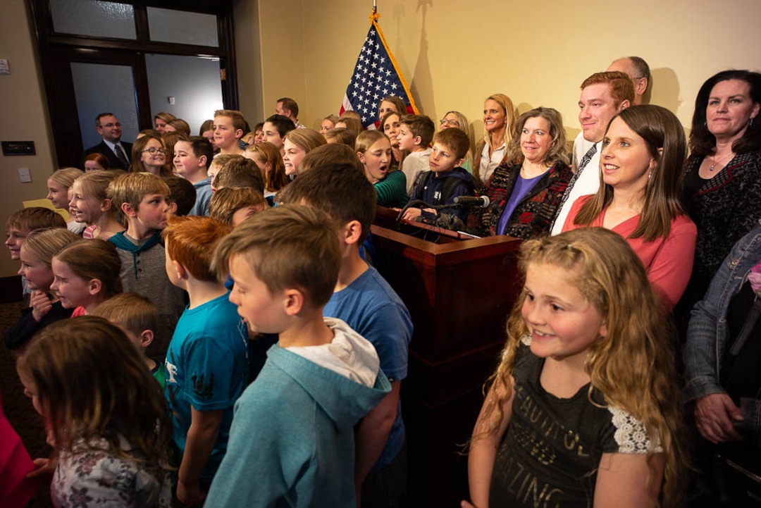 i(Trent Nelson | The Salt Lake Tribune)  Valley View Elementary School teacher Moana Patterson (to right of microphone) poses for a photo with parents and students after a news conference to show support for her, in Salt Lake City on Monday March 11, 2019.