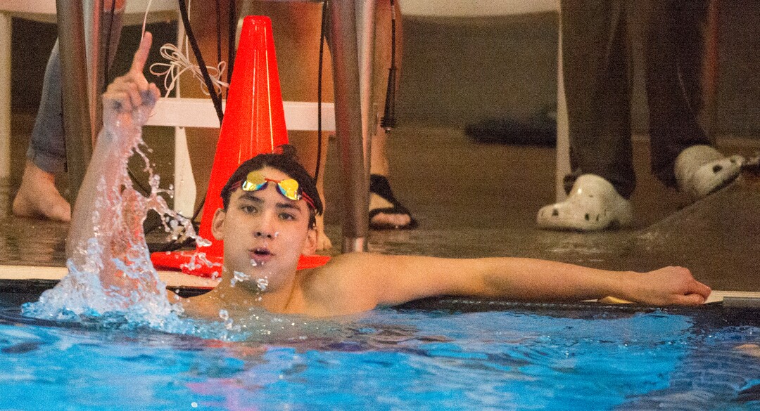 (Rick Egan  |  The Salt Lake Tribune)    Lone Peak Swimmer, Josh Ries celebrates his first place finish in the Men's 100 Yard Backstroke, in 6A State Swimming Championships in Bountiful, Friday, February 9, 2018.