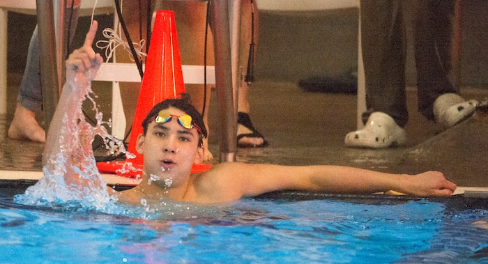 (Rick Egan  |  The Salt Lake Tribune)    Lone Peak Swimmer, Josh Ries celebrates his first place finish in the Men's 100 Yard Backstroke, in 6A State Swimming Championships in Bountiful, Friday, February 9, 2018.