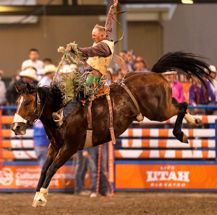 (Rick Egan | The Salt Lake Tribune)  Alan Boore competes in saddle bronc at the Utah Days of '47 Rodeo at the State Fairpark, on Monday, July 25, 2022.