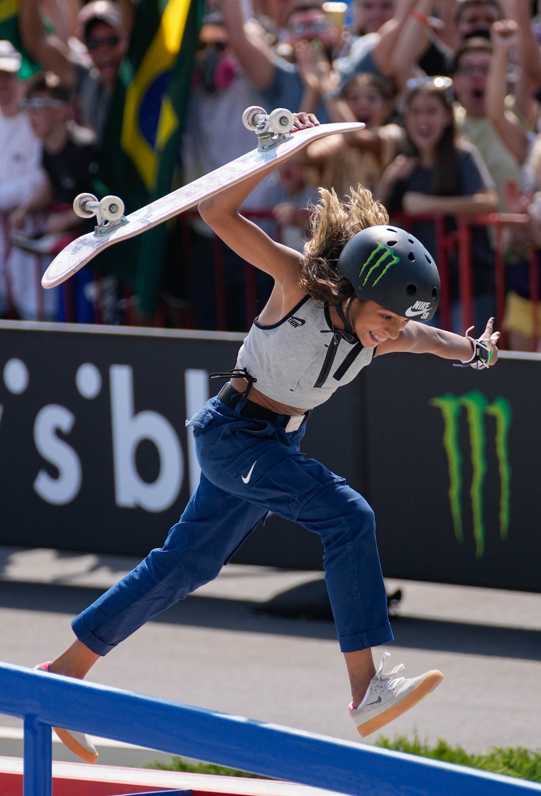 (Francisco Kjolseth | The Salt Lake Tribune) Rayssa Leal of Brazil jumps for joy and slams her board as she celebrates nailing her final trick and winning first place in the Street League Skateboarding Championship Tour at the Utah State Fairpark in Salt Lake City on Saturday, Aug. 28, 2021.