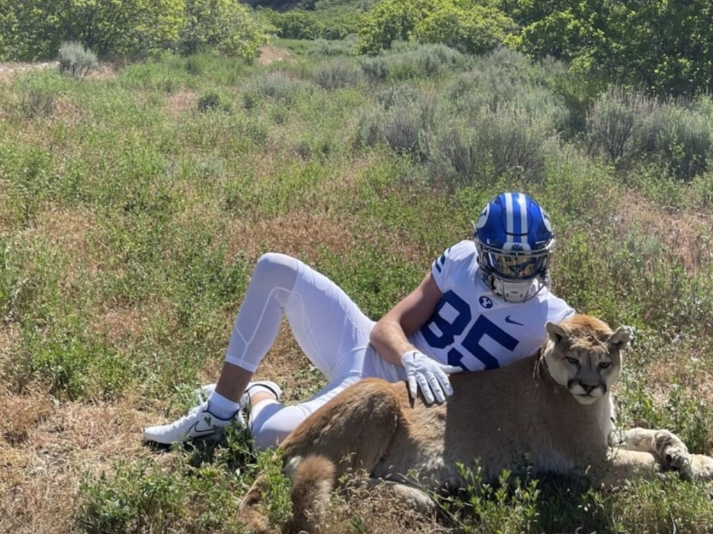 (Kapri Lyons - Instagram) BYU recruit Walker Lyons takes a photo with the fake cougar.