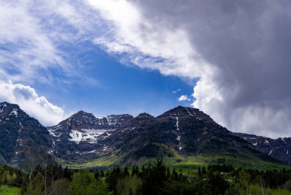 (Francisco Kjolseth | The Salt Lake Tribune) Sun dances across Mount Timpanogos as storm clouds move in on Wednesday, May 19, 2021. 