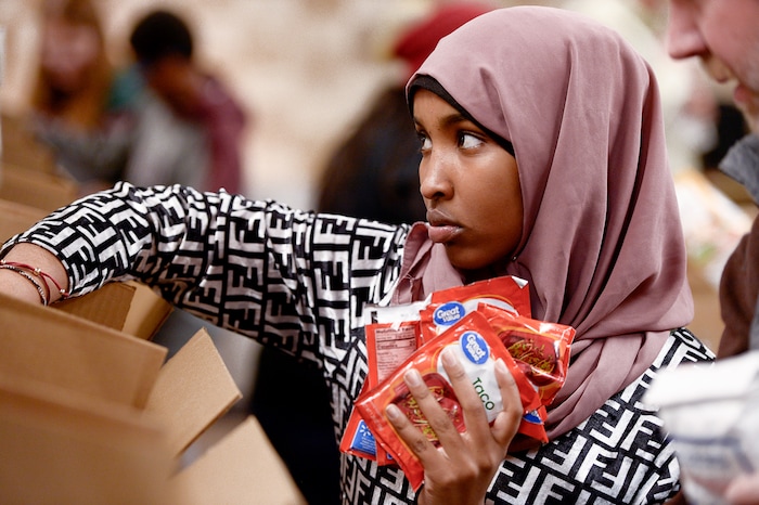 (Francisco Kjolseth  |  The Salt Lake Tribune) Fardosa Ali, 14, a member of YouthCity Government volunteers sorting food at the Utah Food Bank on Monday, Jan. 20, 2020, to celebrate the 2020 Martin Luther King Jr. Day of Service.