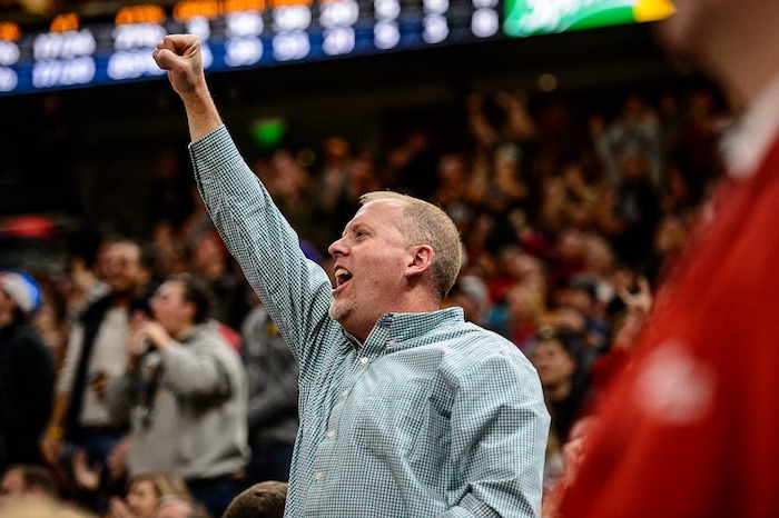(Trent Nelson | The Salt Lake Tribune)  A Jazz fan pumps his fist as Utah Jazz guard Donovan Mitchell (45) hits a three-pointer to give the Jazz a ten point lead with seconds left in the fourth quarter, as the Utah Jazz host the Phoenix Suns, NBA basketball in Salt Lake City, Wednesday Feb. 14, 2018.