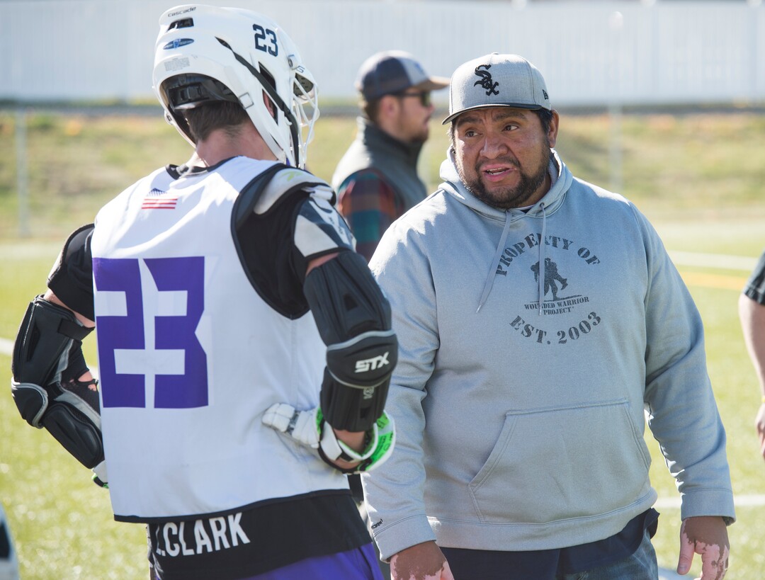 (Rick Egan | The Salt Lake Tribune) Box Elder lacrosse coach Juan Gaytan talks to player Logan Clark during a tournament in Logan on Saturday, Nov. 3, 2018.