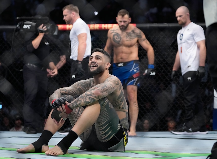 (Francisco Kjolseth | The Salt Lake Tribune) Tyson Pedro of Australia celebrates his quick win in the first round over Harry Hunsucker of the United States in UFC 278 during their mixed martial arts bout in the octagon in Salt Lake City on Saturday, Aug. 20, 2022.  
