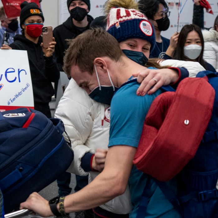 (Rick Egan | The Salt Lake Tribune) Short track speedskater Ryan Pivirotto, is welcomed home with a hug, as he and other Team USA Olympians arrive at the Salt Lake City International Airport on Monday, Feb. 21, 2022.