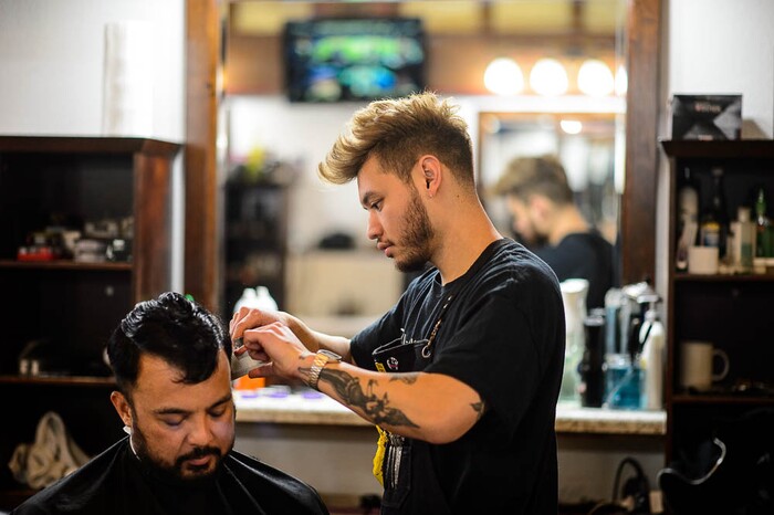 (Trent Nelson | The Salt Lake Tribune)
Derek Neth styles Cal Cruz's hair at Ray's Barber Shop in Salt Lake City on Thursday Feb. 28, 2019.