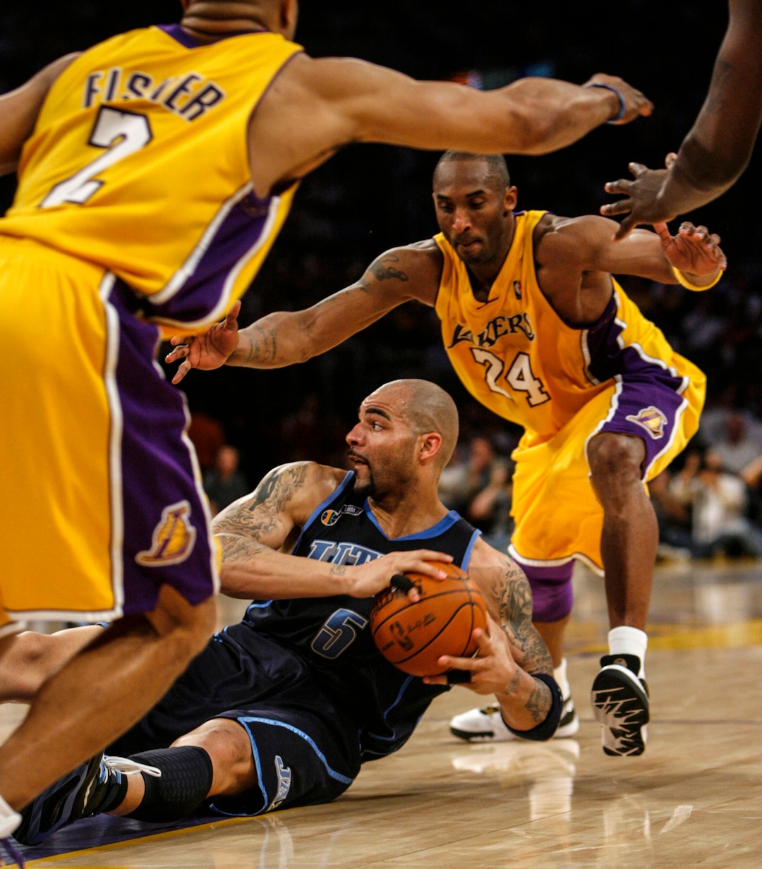 (Trent Nelson  |  The Salt Lake Tribune) Kobe Bryant pressures Carlos Boozer, Utah Jazz vs. Los Angeles Lakers basketball, game two NBA playoffs, Tuesday April 21, 2009 at the Staples Center.