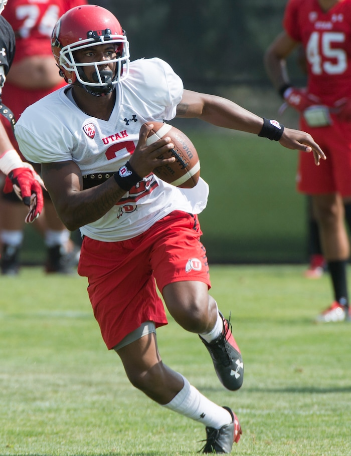 (Rick Egan  |  The Salt Lake Tribune)

Utah quarterback Troy Williams runs with the ball, during practice, Monday, August 7, 2017.


