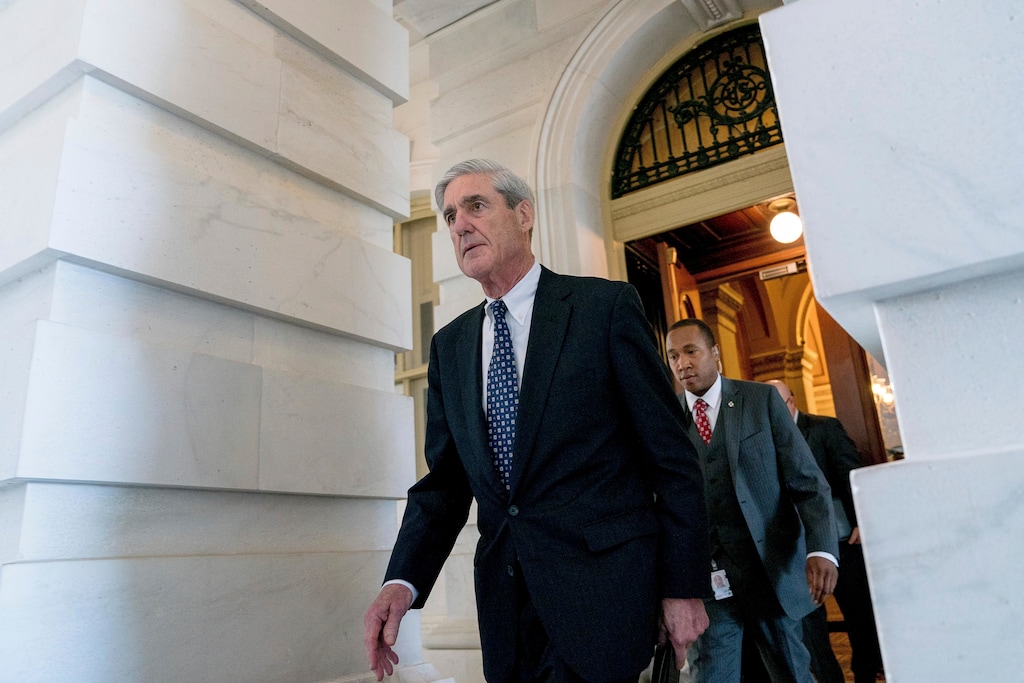 (Andrew Harnik | The Associated Press) In this June 21, 2017 file photo, former FBI Director Robert Mueller, the special counsel probing Russian interference in the 2016 election, departs Capitol Hill following a closed door meeting in Washington. A spokesman for special counsel Mueller says the office has referred to the FBI allegations that women were offered money to make up false claims about Mueller.