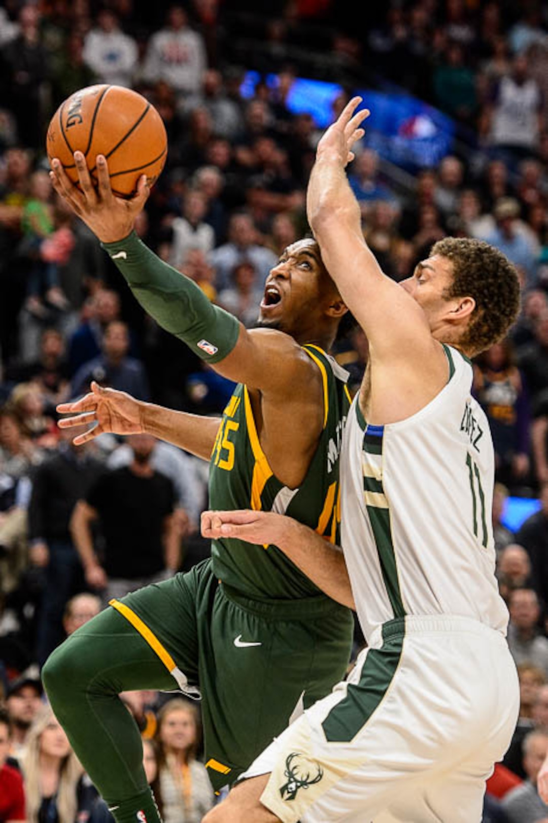 (Trent Nelson | The Salt Lake Tribune)  Utah Jazz guard Donovan Mitchell (45) scores in the fourth quarter as the Utah Jazz host the Milwaukee Bucks, NBA basketball in Salt Lake City on Saturday March 2, 2019.