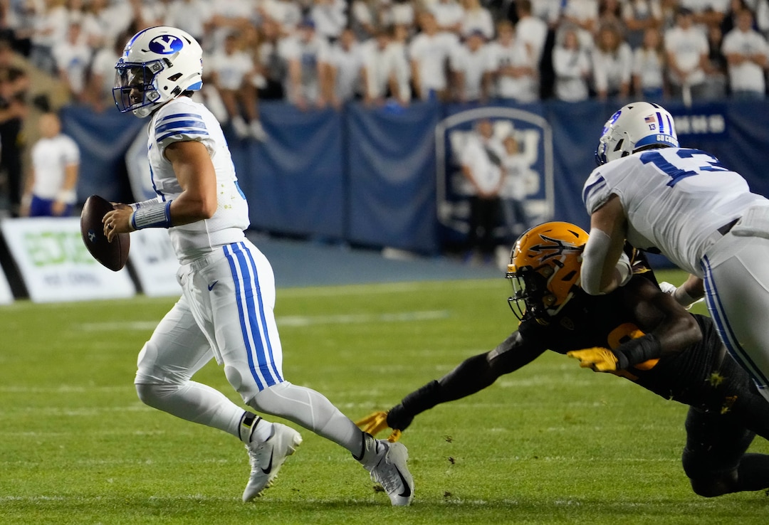 (Francisco Kjolseth | The Salt Lake Tribune) Brigham Young Cougars quarterback Jaren Hall (3) outruns the Arizona defense for a touchdown pass in football action between the Brigham Young Cougars and the Arizona State Sun Devils at LaVell Edwards Stadium in Provo, on Saturday, Sept. 18, 2021.
