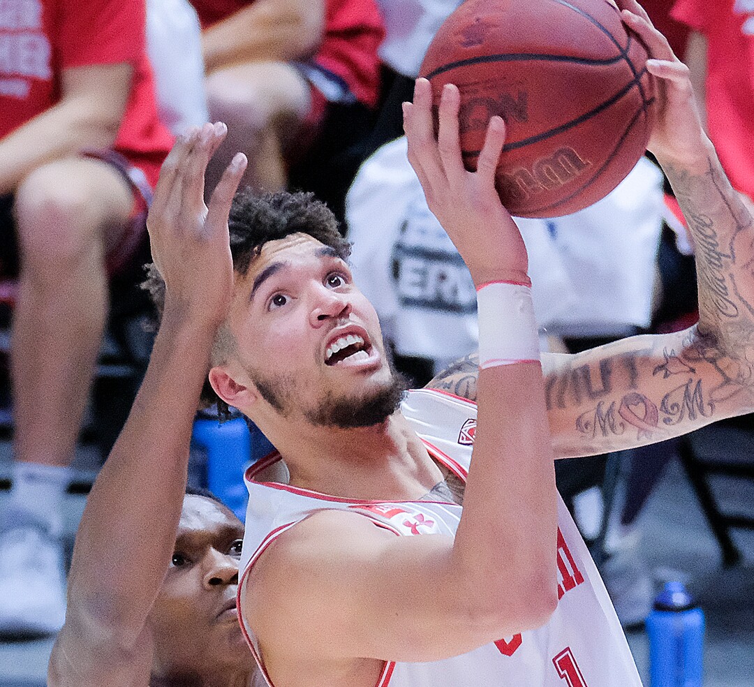 (Leah Hogsten | The Salt Lake Tribune) Utah Utes forward Timmy Allen (1) slips past Arizona Wildcats guard Bennedict Mathurin (0) for the bucket as the University of Utah host the Arizona Wildcats, Feb. 4, 2021 at the Jon M. Huntsman Arena.