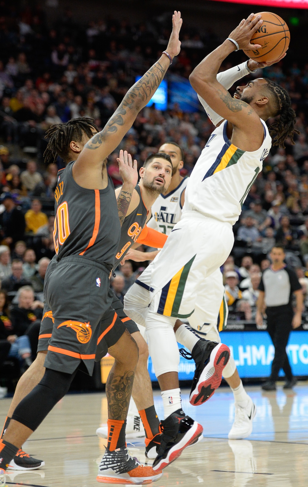 (Francisco Kjolseth  |  The Salt Lake Tribune) Orlando Magic guard Markelle Fultz (20) pressures Utah Jazz guard Mike Conley (10) as the Utah Jazz host the Orlando Magic in their NBA basketball game at Vivint Smart Home Arena in Salt Lake City on Tuesday. Dec. 17, 2019.