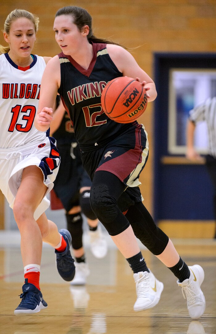 (Trent Nelson  |  The Salt Lake Tribune)  Viewmont's Mercedes Staples drives past Sara Noel as Woods Cross hosts Viewpoint High School girls basketball, Wednesday, January 24, 2018.