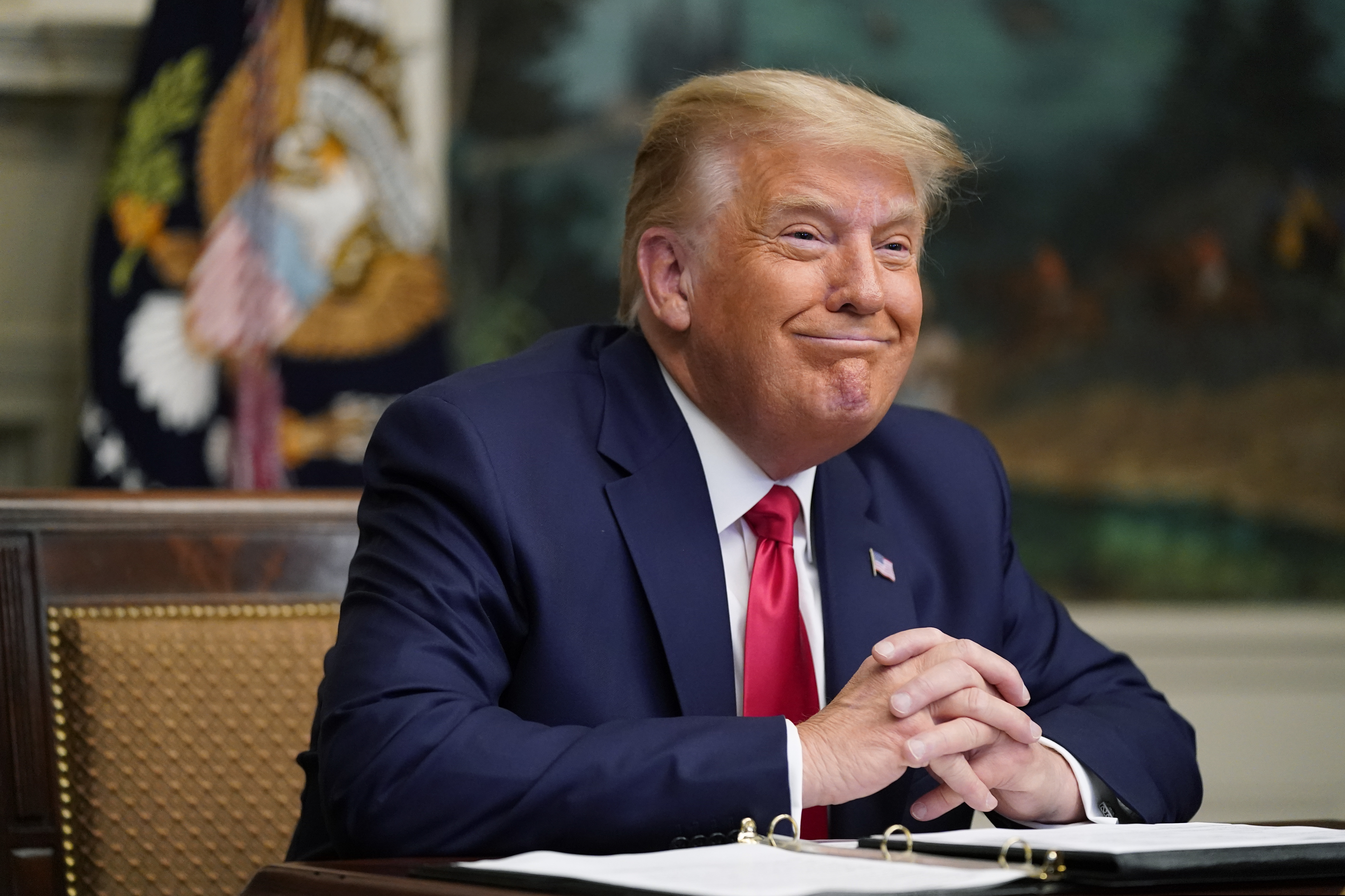 President Donald Trump participates in a video teleconference call with members of the military on Thanksgiving, Thursday, Nov. 26, 2020, at the White House in Washington. (AP Photo/Patrick Semansky)