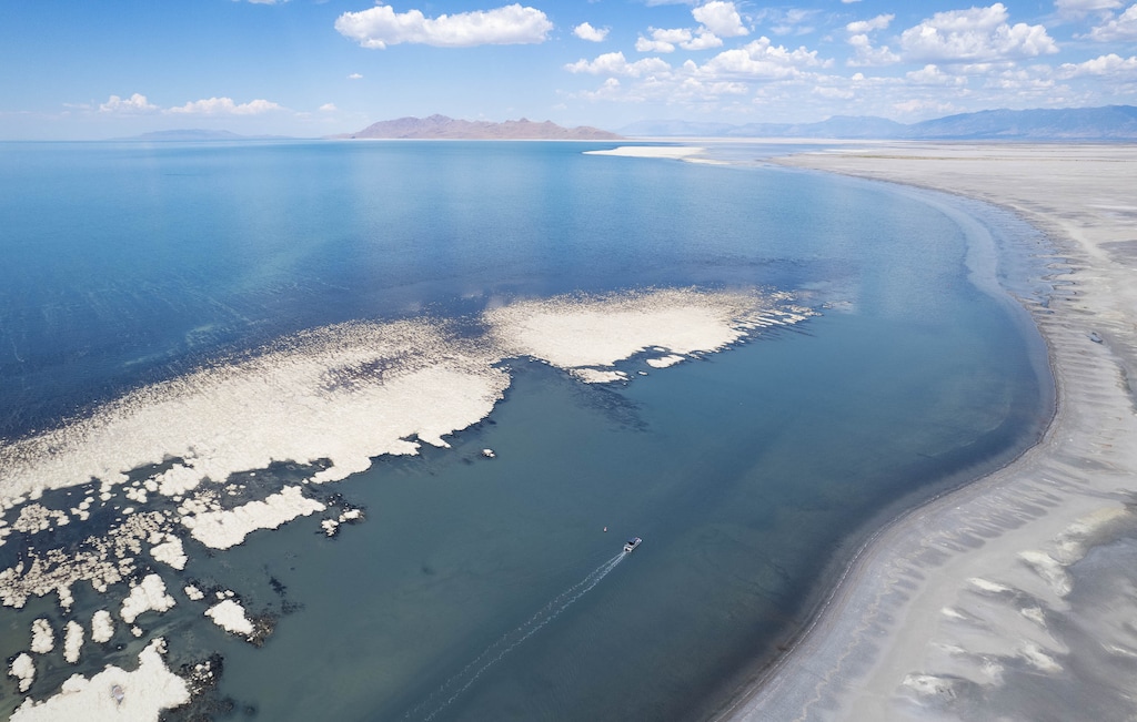 (Francisco Kjolseth | The Salt Lake Tribune) A boat tour departs from the Great Salt Lake Marina on Tuesday, Aug. 16, 2022, as it follows a very narrow corridor deep enough to accommodate the pontoon boat with limited passengers as dry lakebed continues to emerge from the shallow lake. With all other boats now removed from the marina, lake tour operations are expected to end within the week during the ongoing drought.