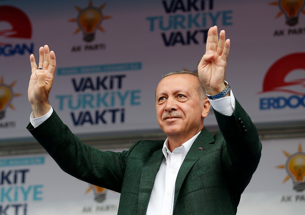 Turkey's President Recep Tayyip Erdogan, addresses supporters of his ruling Justice and Development Party (AKP) during an election rally for the upcoming June 24, elections, in Samsun, Turkey on Monday, June 18, 2018. Turkey announced its troops began patrols on the outskirts of the key northern Syrian town of Manbij following a recent deal struck with the United States and Erdogan confirmed the patrol began in his speech. (Presidency Press Service via AP, Pool)