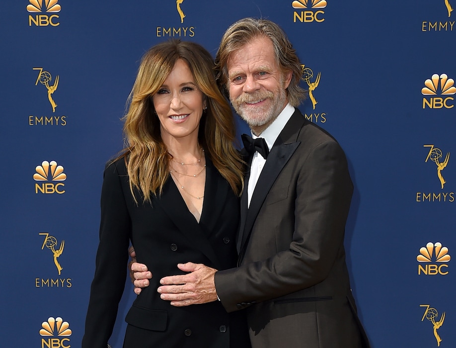 FILE - In this Sept. 17, 2018 file photo, Felicity Huffman, left, and William H. Macy arrive at the 70th Primetime Emmy Awards in Los Angeles.  (Photo by Jordan Strauss/Invision/AP, File)