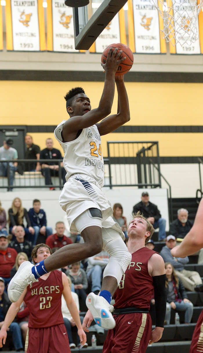 (Leah Hogsten  |  The Salt Lake Tribune) Summit's Jamari Egbert aims for the net. Juab High School boys' basketball team defeated Summit Academy 61-58 during their 3A State tournament game in Heber  Saturday, Feb. 16, 2018.