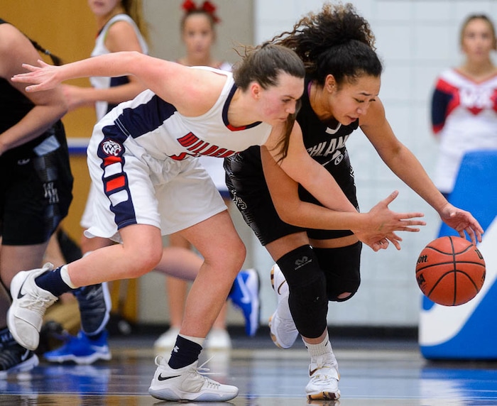 (Trent Nelson | The Salt Lake Tribune)  Woods Cross's Allee Mckenna (2) and Highland's Misini Fifita (34) reach for a loose ball as Woods Cross faces Highland in the 5A High School Girls' Basketball Tournament at SLCC in Taylorsville, Wednesday Feb. 21, 2018.