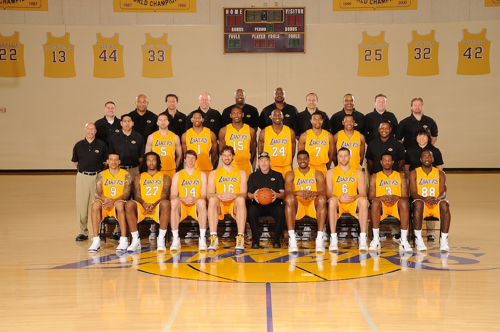 Andrew D. Bernstein | NBAE via Getty Images
Quin Snyder (third from left) and Ettore Messina (forth from left) on the 2012 Los Angeles Lakers coaching staff under Head Coach Mike Brown.
The Los Angeles Lakers pose for a team photo at Toyota Sports Center on April 16, 2012 in El Segundo, California. Back Row: Tim DiFrancesco (Strength and Conditioning Coach), Darvin Ham (Assistant Coach), Quin Snyder (Assistant Coach), John Kuester (Assistant Coach), Mike Brown (Head Coach), Chuck Person (Assistant Coach), Ettore Messina (Coaching Consultant), Phil Handy (Player Development Coach), Kyle Triggs (Assistant to the Head Coach), Marko Yrjovuori (Sports Massage Therapist)
Middle Row: Gary Vitti (Athletic Trainer), Marco Nunez (Assistant Athletic Trainer), Steve Blake, Darius Morris, Metta World Peace, Kobe Bryant, Ramon Sessions, Andrew Goudelock, Carlos Maples (Equipment Manager), Dr. Judy Seto (Head Physical Therapist) Front Row: Matt Barnes, Jordan Hill, Troy Murphy, Pau Gasol, Jim Buss (Executive Vice President of Player Personnel), Andrew Bynum, Josh McRoberts, Devin Ebanks, Christian Eyenga.