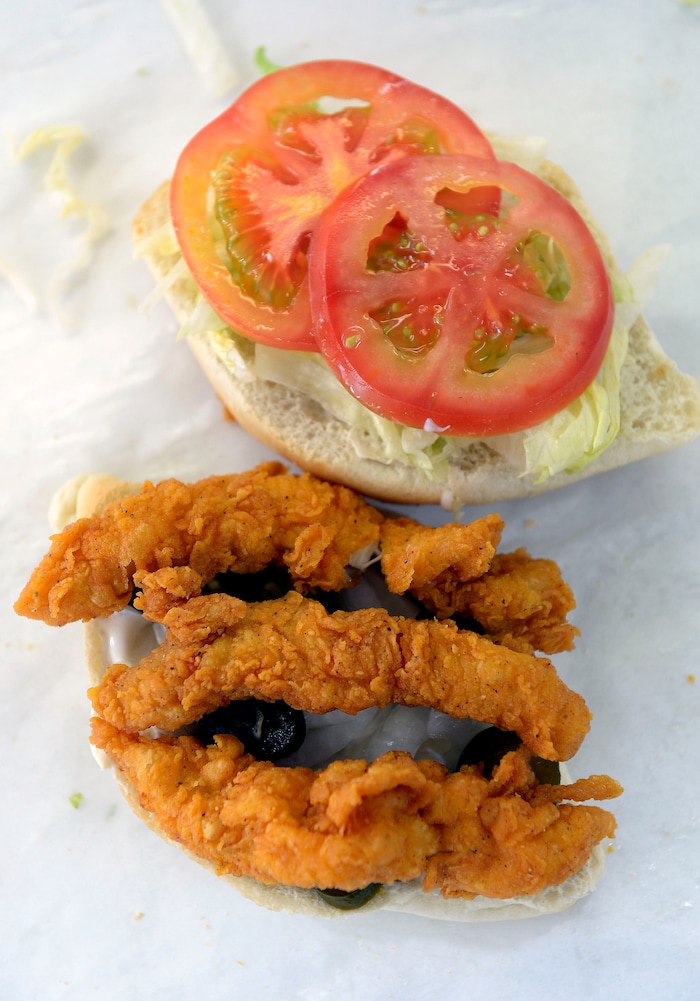 (Al Hartmann | The Salt Lake Tribune) A chicken sandwich at Kevin's Fried Chicken, located inside the Food Mart/Gas Station at 524 W. 4500 South in Murray. Owner Kevin Nguyen has a secret recipe for the spicy breading, using real chicken pieces (not pressed). He sells chicken strips, pieces, chicken sandwiches and amazing potato wedges to a loyal lunch crowd.