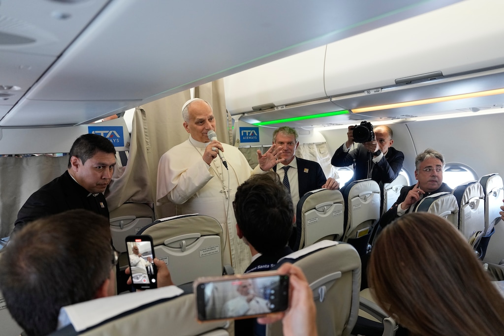 (Alessandra Tarantino | AP, pool via RNS) Pope Leo XIV talks to journalists aboard the papal flight from Rome to Madrid, Saturday, June 6, 2026.