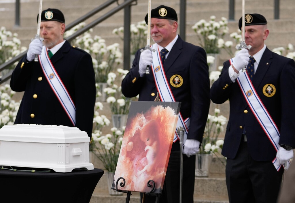 (Francisco Kjolseth | The Salt Lake Tribune) A Knights of Columbus honor guard stands by a symbolic casket during a pro-life memorial service in front of the Capitol in Salt Lake City on Wednesday, Jan. 25, 2023, to honor the lives of 1,746 unborn babies that were aborted in Utah in 2022.