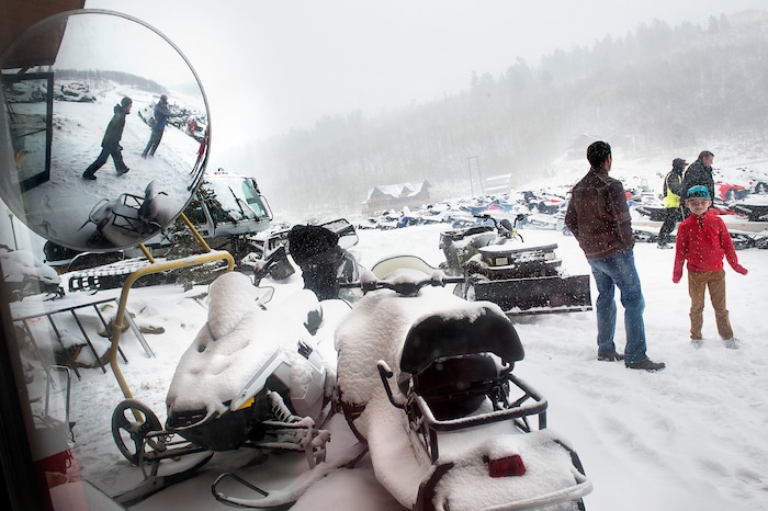 (Scott Sommerdorf   |  The Salt Lake Tribune)   
Renters leave the lodge to jump on their rented snowmobiles at Daniel Summit Saturday, December 23, 2017. While the number of snowmobile licenses in Utah is declining, trail usage is up dramatically.  