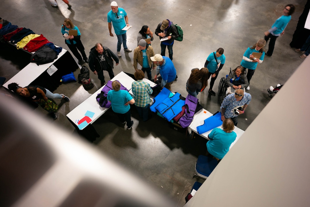 (Trent Nelson  |  The Salt Lake Tribune)Clothing is handed out at Project Homeless Connect, where community volunteers to provide services for individuals and families experiencing homelessness, at the Salt Palace Convention Center in Salt Lake City on Friday Oct. 25, 2019.