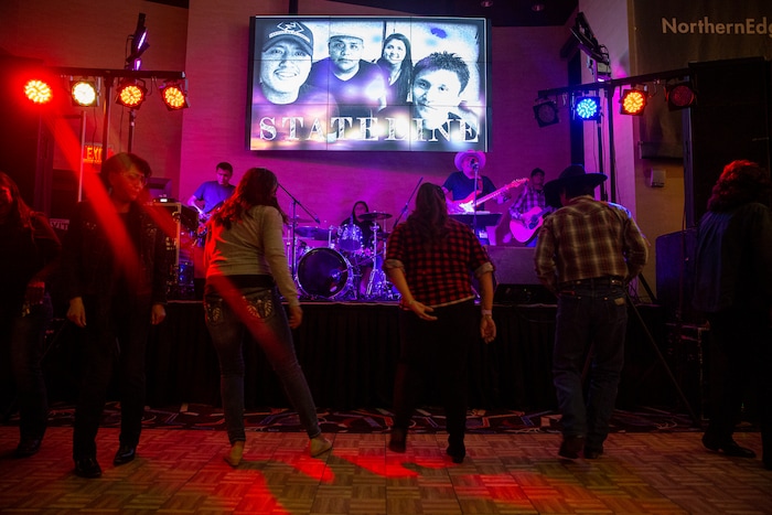 (Adriana Zehbrauskas | The New York Times) The dance floor at Stateline's show at the Northern Edge Casino in Farmington, N.M., Nov. 8, 2019. At highway honky-tonks, casino lounges and far-flung dance halls, a form of music that many associate with rural white America is flourishing in the heart of Indian country, and no tribe have put their own stamp on country music quite like the Navajo.