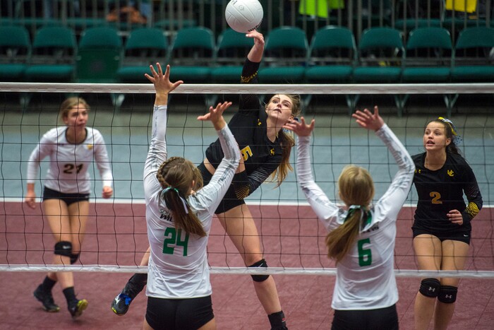 (Chris Detrick  |  The Salt Lake Tribune)  Union's Taylor Rundell (5) spikes past South Summit's Kinley Gines (24) and South Summit's Kirsten Atkinson (6) during the 3A volleyball state quarterfinals at the UCCU Center at Utah Valley University Wednesday, October 25, 2017.  