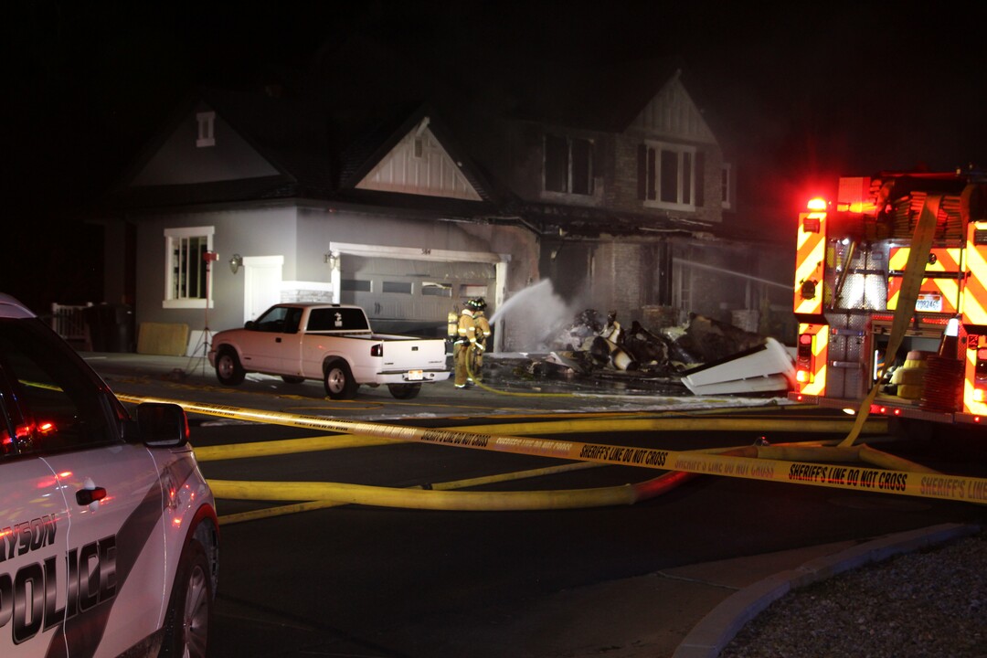 (Photo courtesy of FOX 13) A small plane crashed into a house in Payson early Monday, killing the pilot — but the two occupants of the home escaped without injury despite an explosion and fire that engulfed the structure.