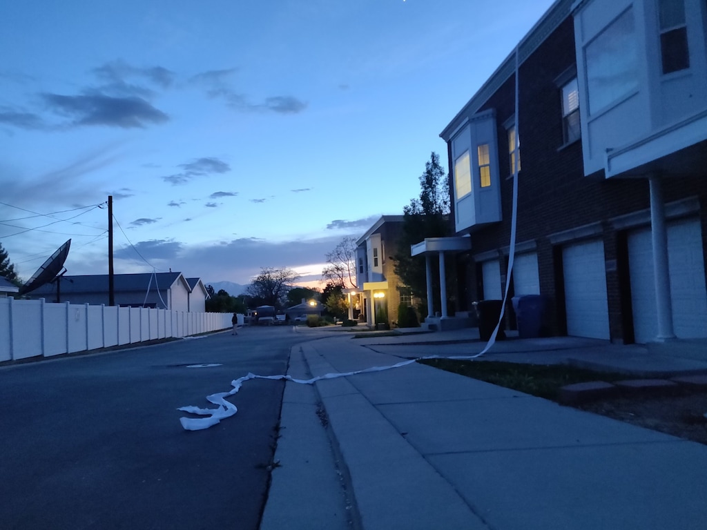(Photo courtesy Arianna Pickard) Toilet paper cascades down a building's facade on May 1, 2020. The toilet paper was dropped from a helicopter near 3600 S. 1300 East in Millcreek, and it's unclear why.